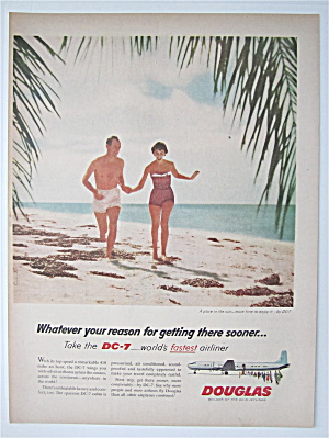 1957 Douglas Dc-7 Airliner With Couple Running On Beach