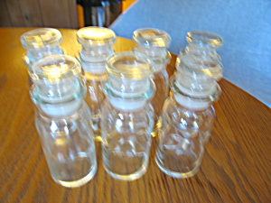 Seven Large Glass Spice Jars