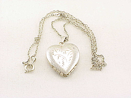 Silver Tone Etched Four Photograph Locket Necklace